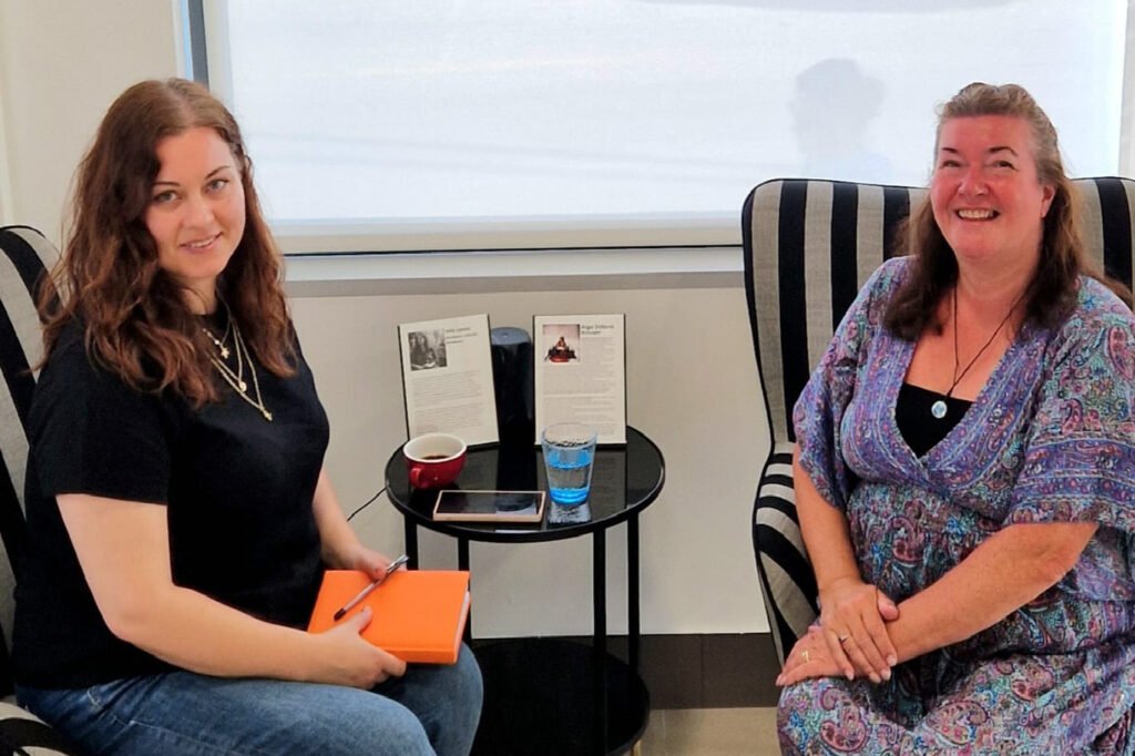 Inta and Karen during their heartfelt conversation at the gallery