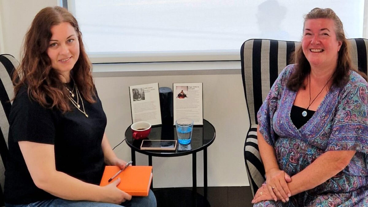 Inta and Karen during their heartfelt conversation at the gallery